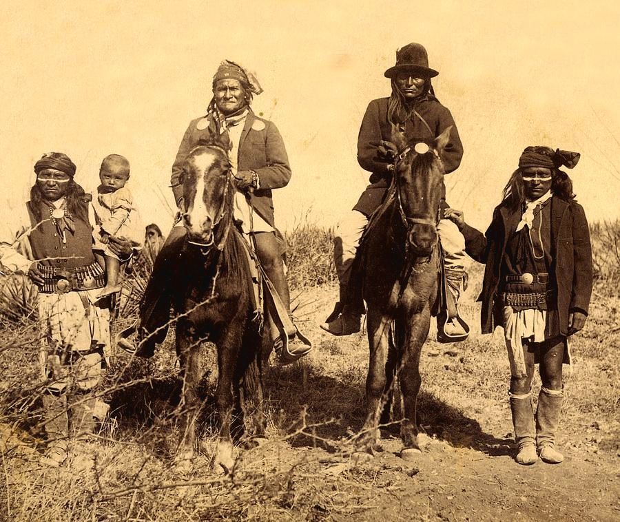 Historic photograph of Native American figures on horseback, capturing a glimpse of their traditional way of life.