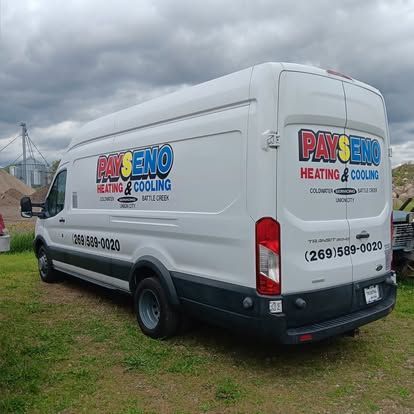 A white van that says payseno heating and cooling is parked in a grassy field.