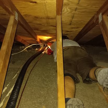 payseno working fixing duct in house 