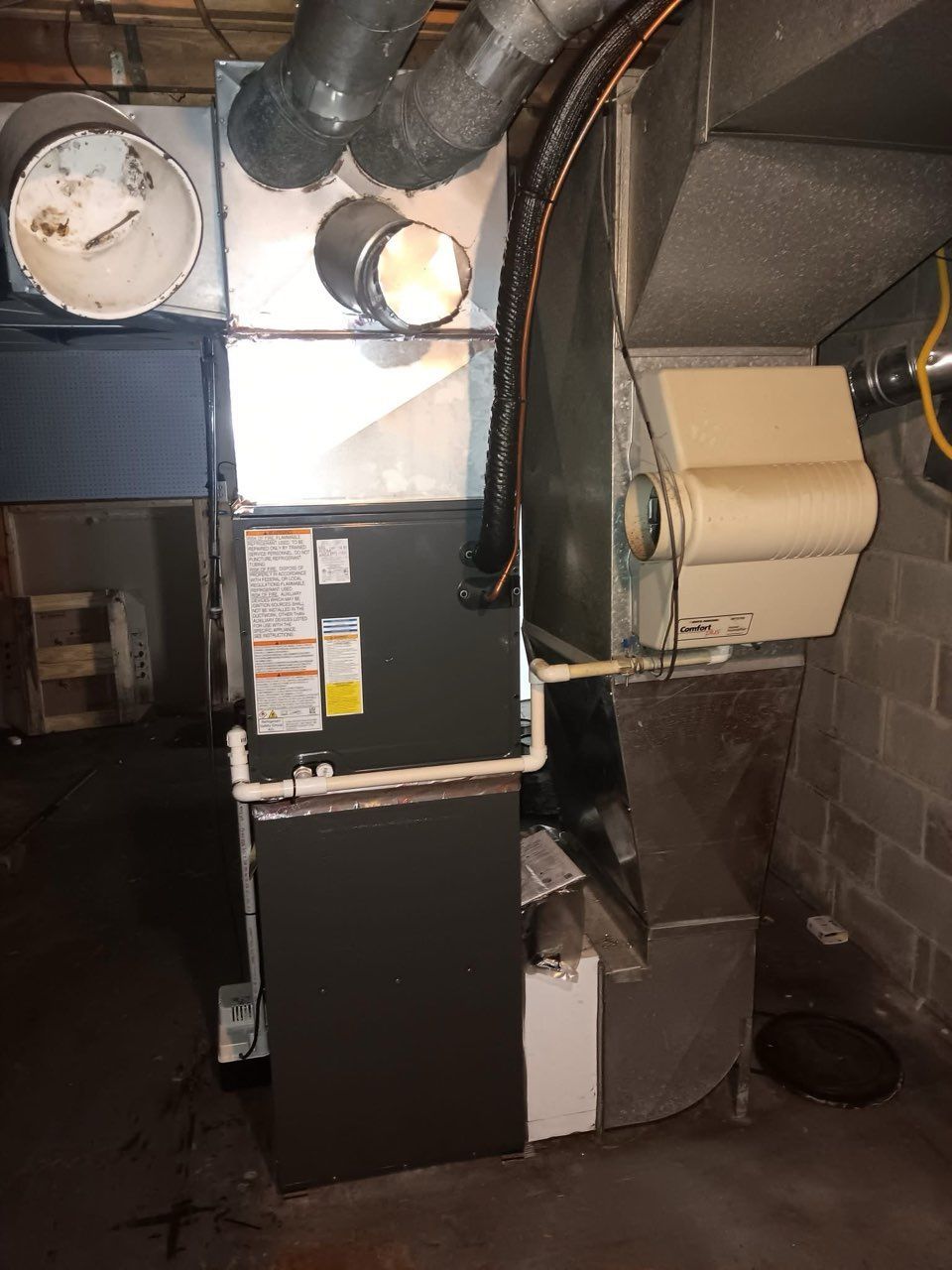 payseno-technician-performing-furnace-maintenance.jpg