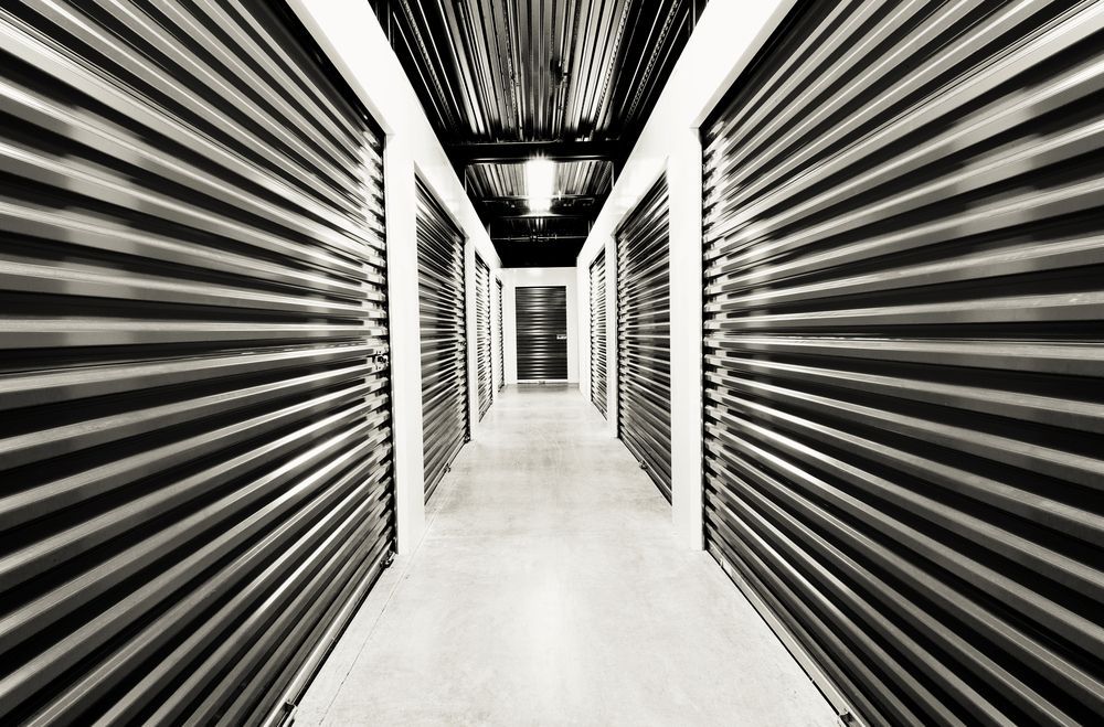 A Long Hallway of Self-storage Units With Metallic Doors — Gympie Southside Mini Storage in Southside, QLD