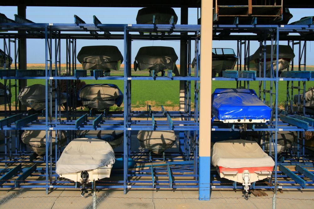 Boats Stored in a Multi-level Rack, Many Covered With Protective Tarps — Gympie Southside Mini Storage in Southside, QLD