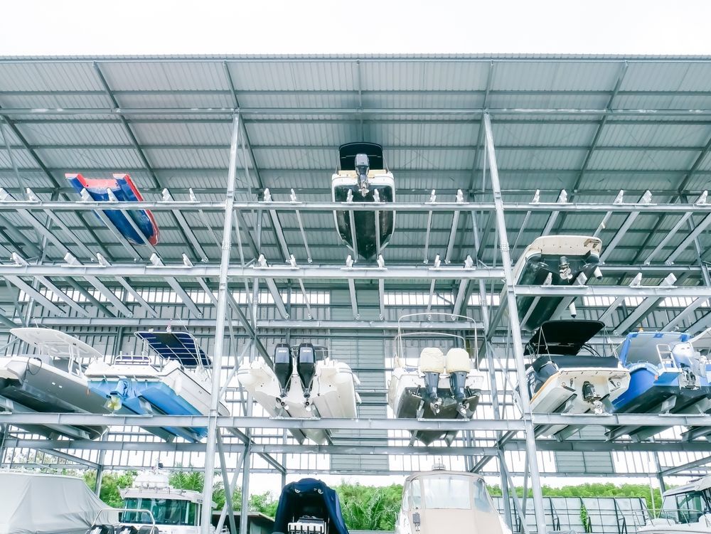 Boats Stored on Shelves in a Metal Boat Storage Facility — Gympie Southside Mini Storage in Southside, QLD