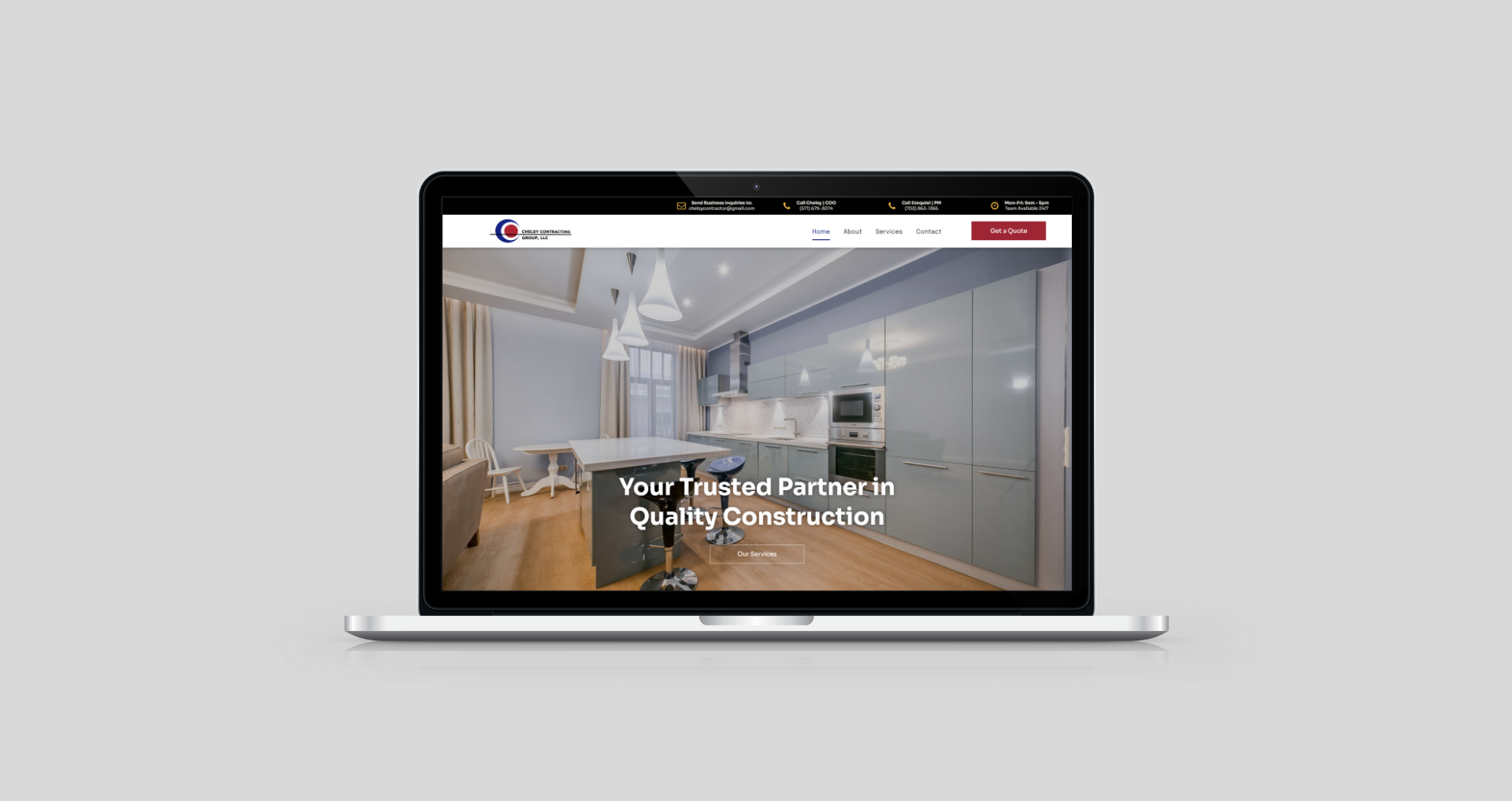 Laptop displaying a kitchen design website with a modern interior.