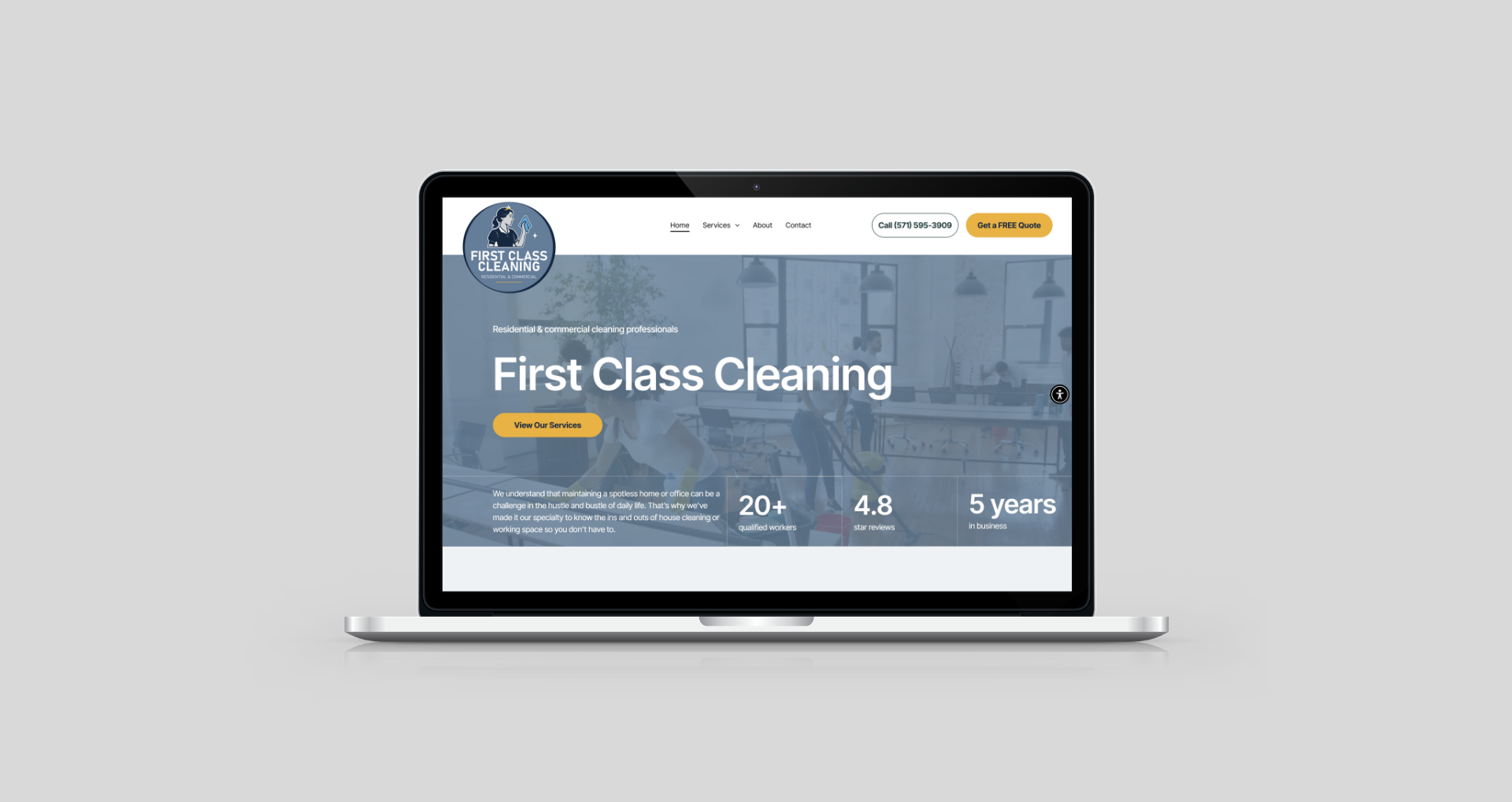 A laptop displays a business website for