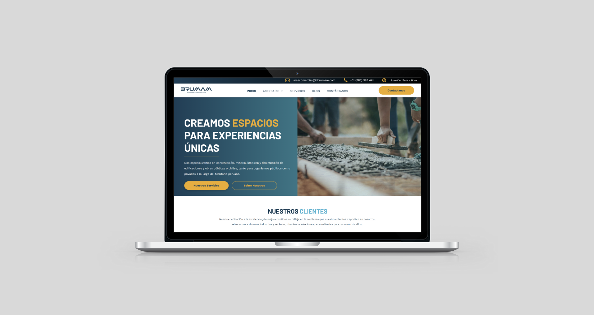 Laptop displaying a website with construction site imagery. Website promotes creating spaces.