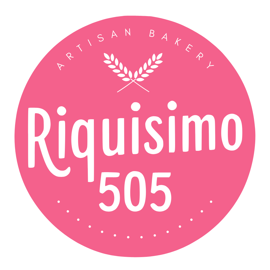Pink circle logo for Riquisimo 505 Artisan Bakery with white text and wheat icon.