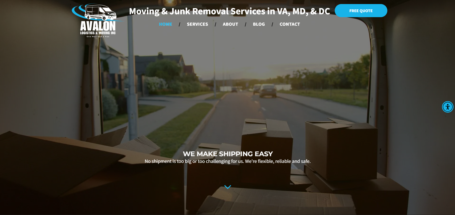 Boxes inside a moving truck, looking out onto a residential street. Website for moving services.