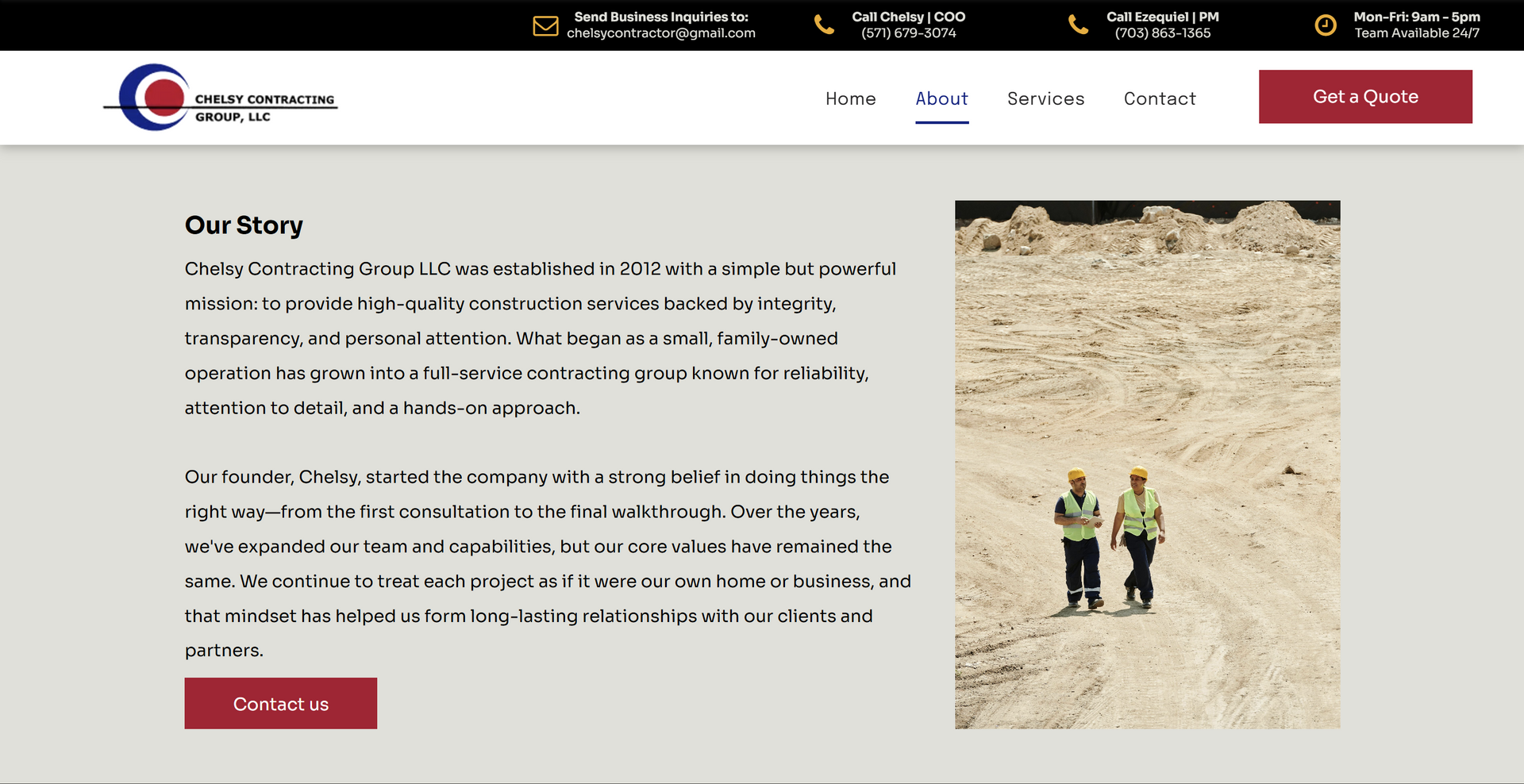 Two workers wearing safety vests and helmets walk on a worksite.