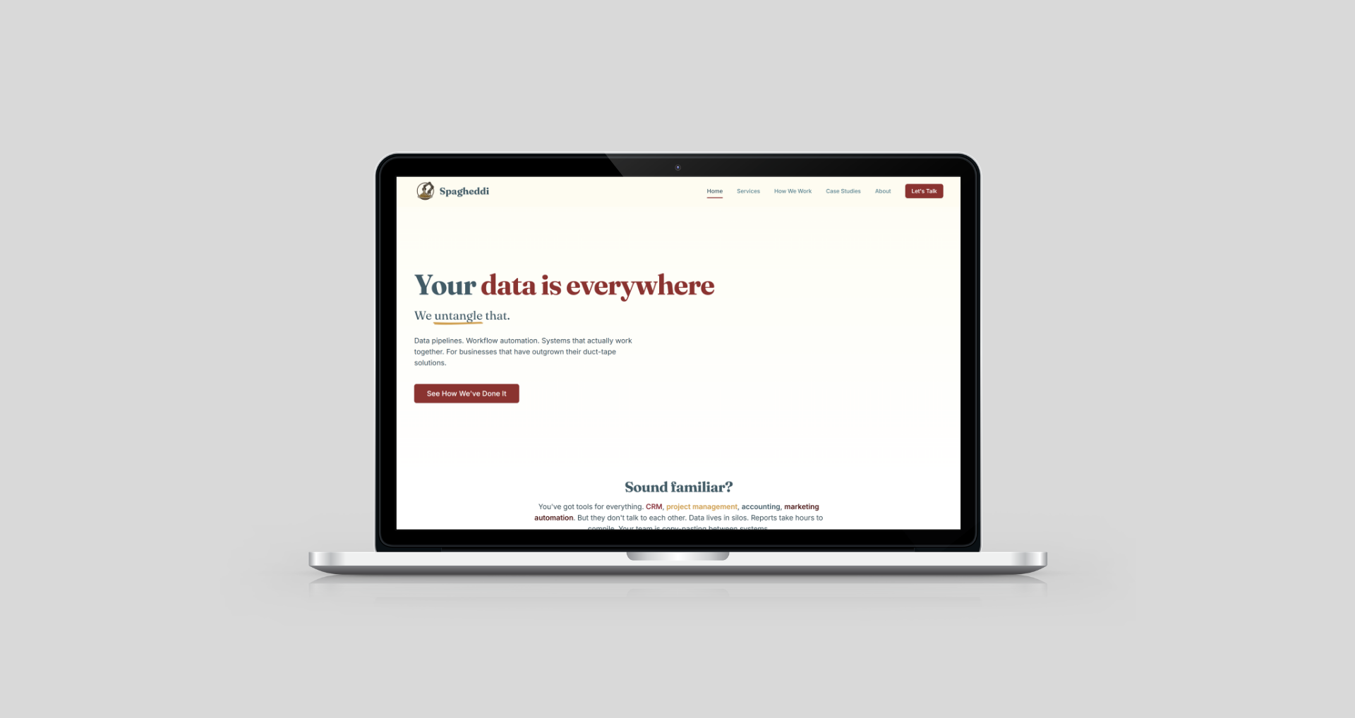 A laptop displays a website homepage for a data company, featuring the headline 