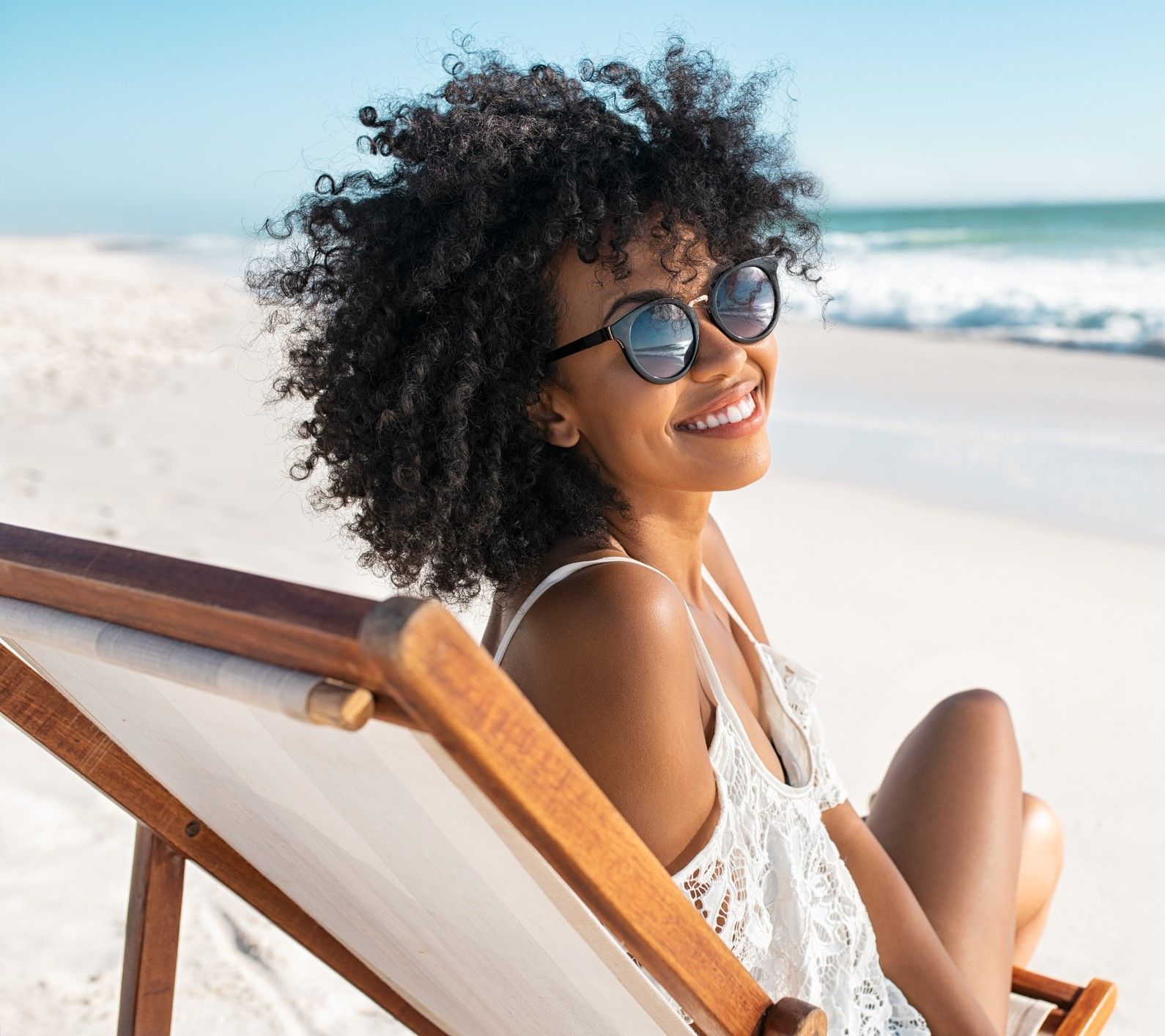 A Woman is Sitting in a Beach Chair – Largo, FL - Optical Factory and Showroom