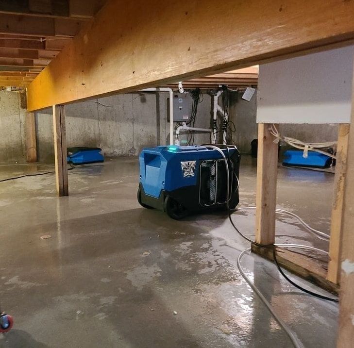 A blue machine in a basement that says ' flood ' on it