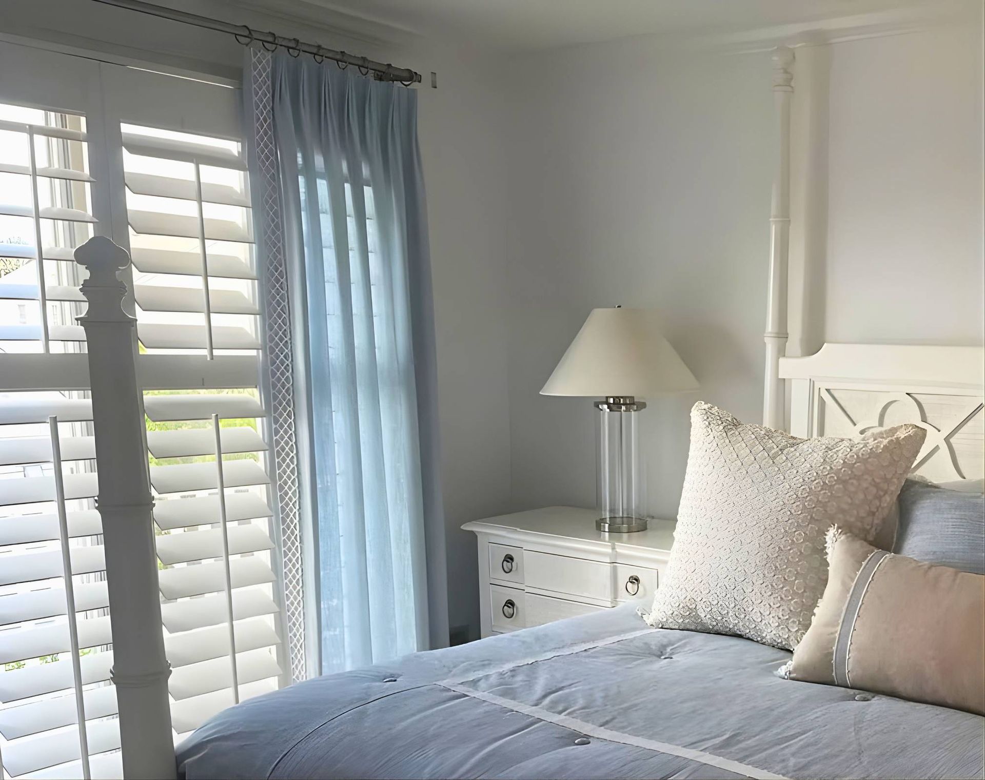 Drapery layered with custom shutters near Manasquan, New Jersey