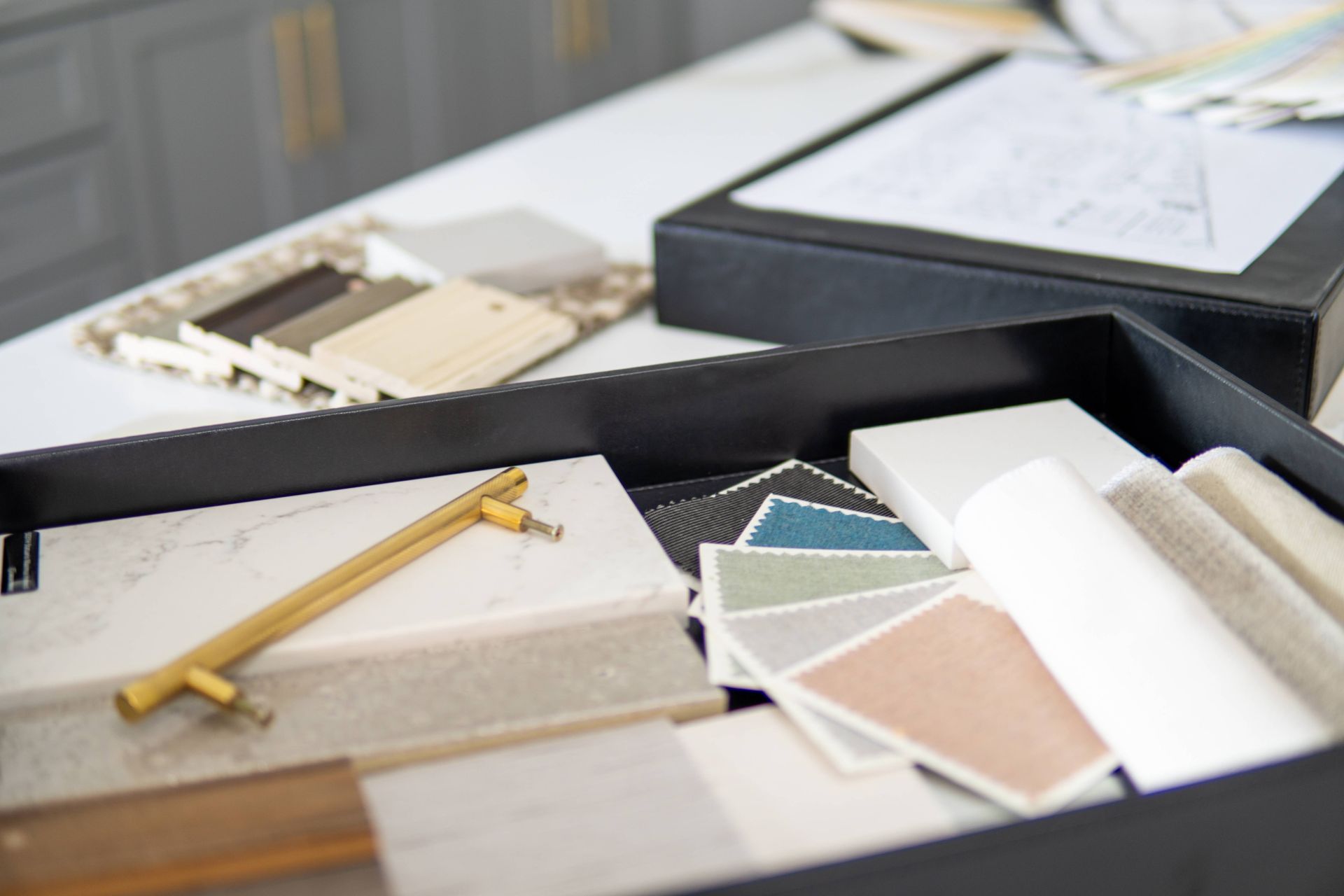 Interior design plan with a color palette and furniture and fabric samples.