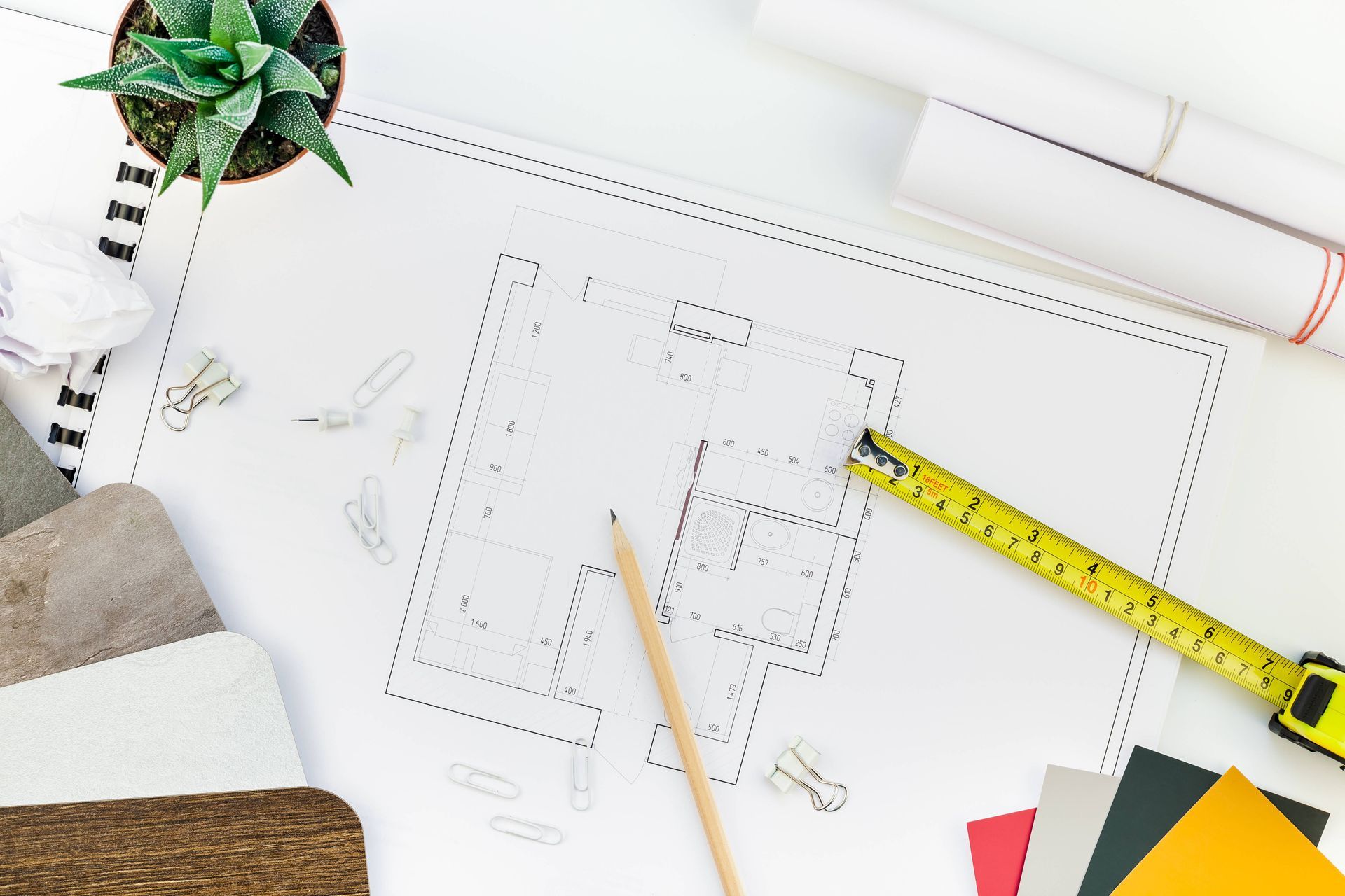 Interior designer table workplace with house plan near Manasquan, NJ