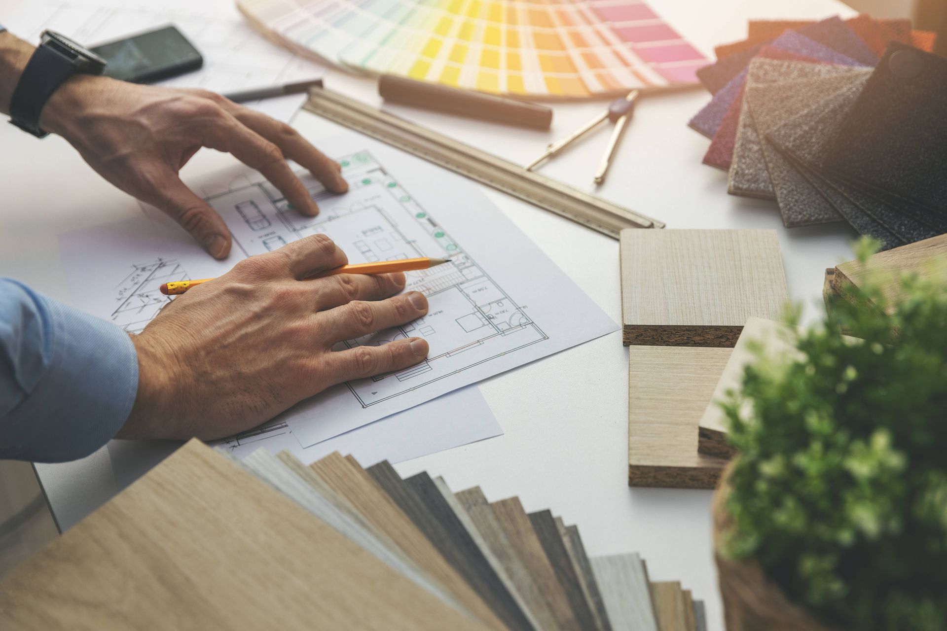 Interior designer working with interior design plan in office near Manasquan, NJ
