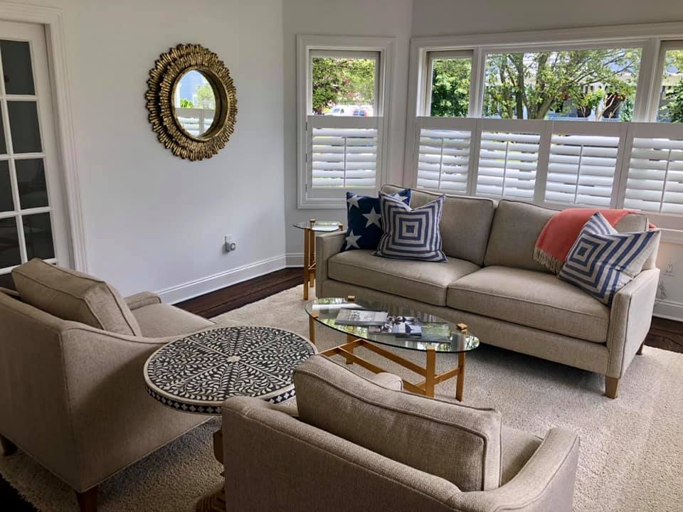 A sitting area with café shutters