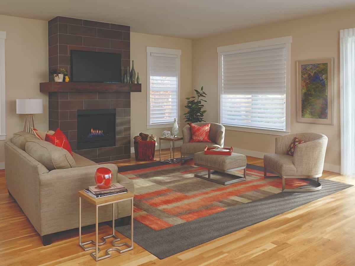A contemporary living room with tiled fireplace.