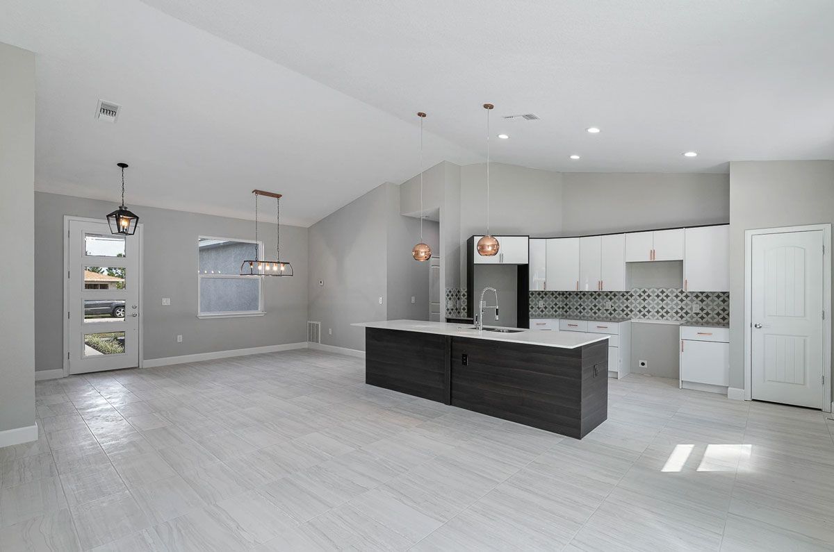 A kitchen with a large island in the middle of the room.