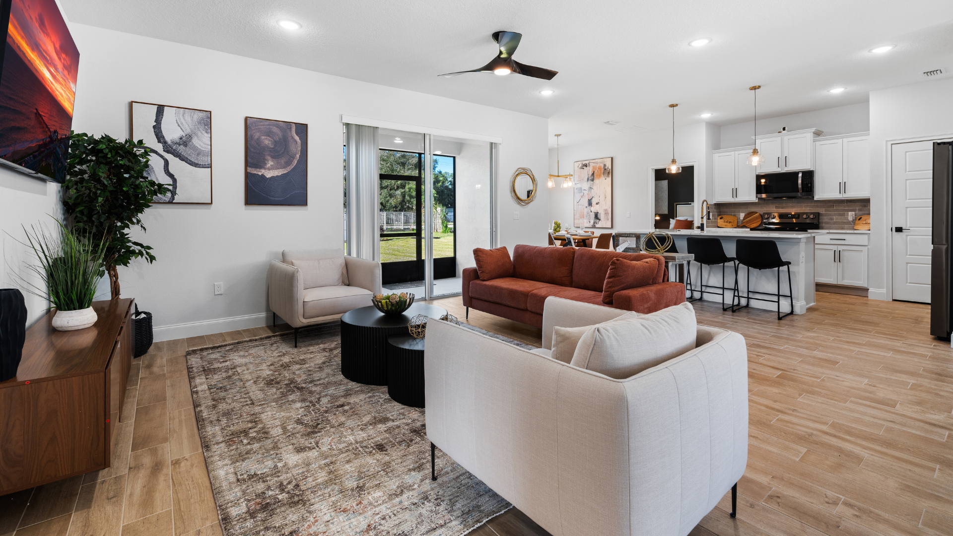 Spacious Caspian Homes Grand Alborz home interior with open floor plan, modern kitchen flowing into living room, natural lighting, and warm, lived-in design, showcasing contemporary residential style.