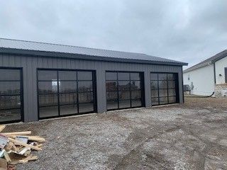 A garage with a lot of windows is being built.