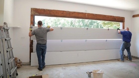 Sharp Overhead Door Service installing garage door in Liberty MO for professional home safety