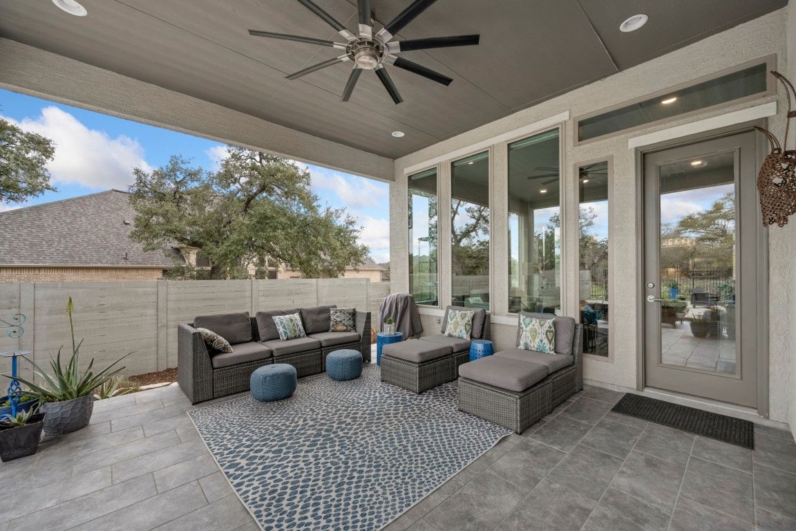 outdoor furniture on stamped concrete patio on a backyard