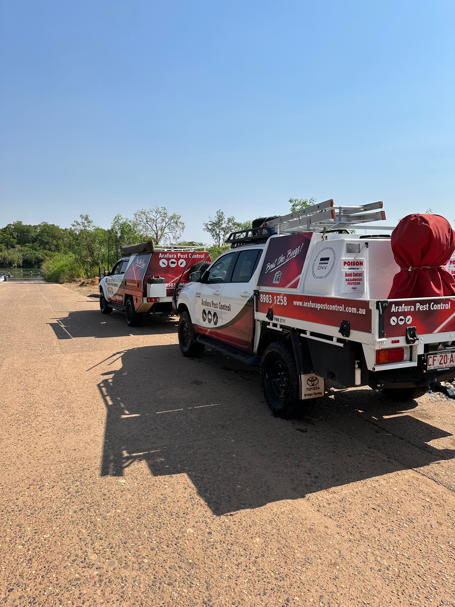 A Man In A Protective Suit Is Spraying Chemicals In A Warehouse  — Arafura Pest Control Darwin In Yarrawonga, NT