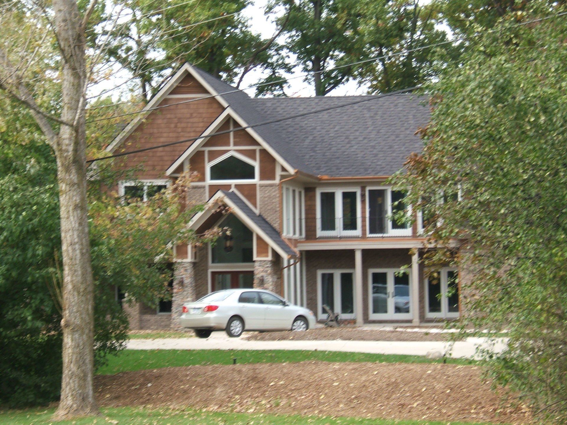Front house with white car