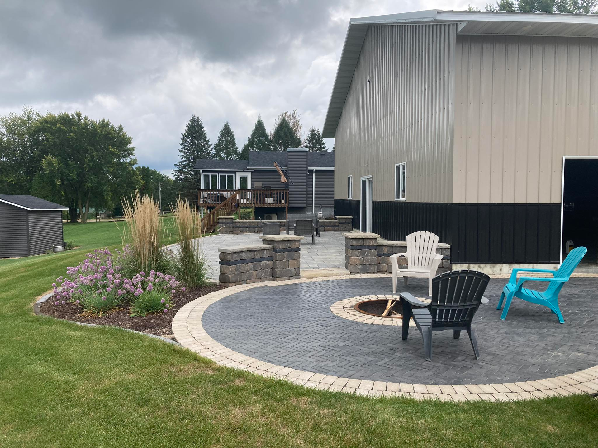 A house with a lush green lawn in front of it