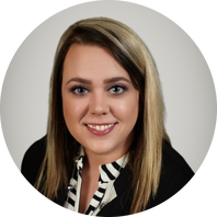A woman in a black and white shirt is smiling in a circle.