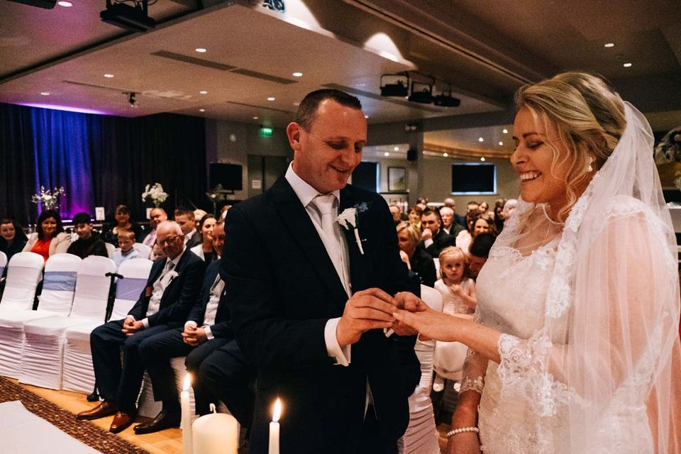 Bride and groom exchanging rings - Bantry wedding photographer