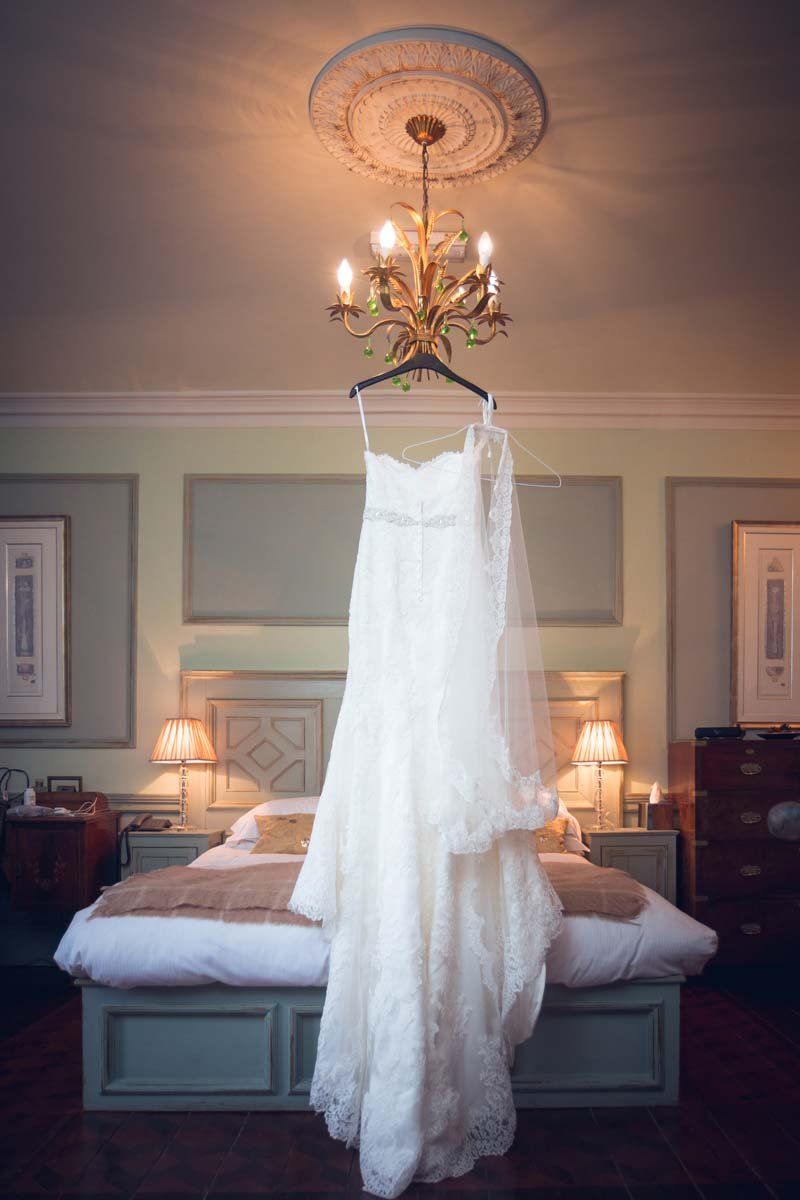 Ballinacurra House wedding dress hanging from chandelier 