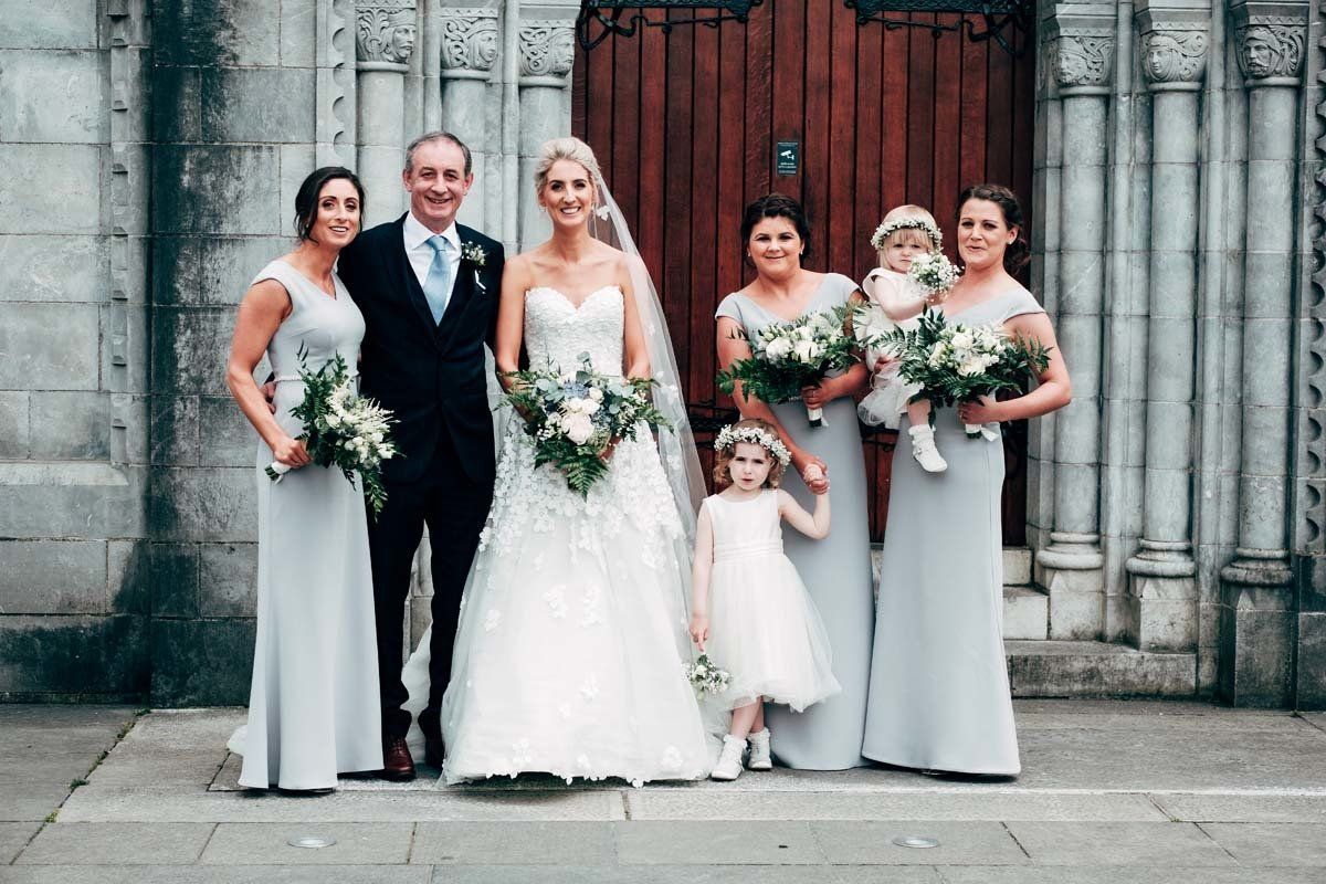 Wedding group photo before walking down the aisle at UCC Honan Chapel Cork