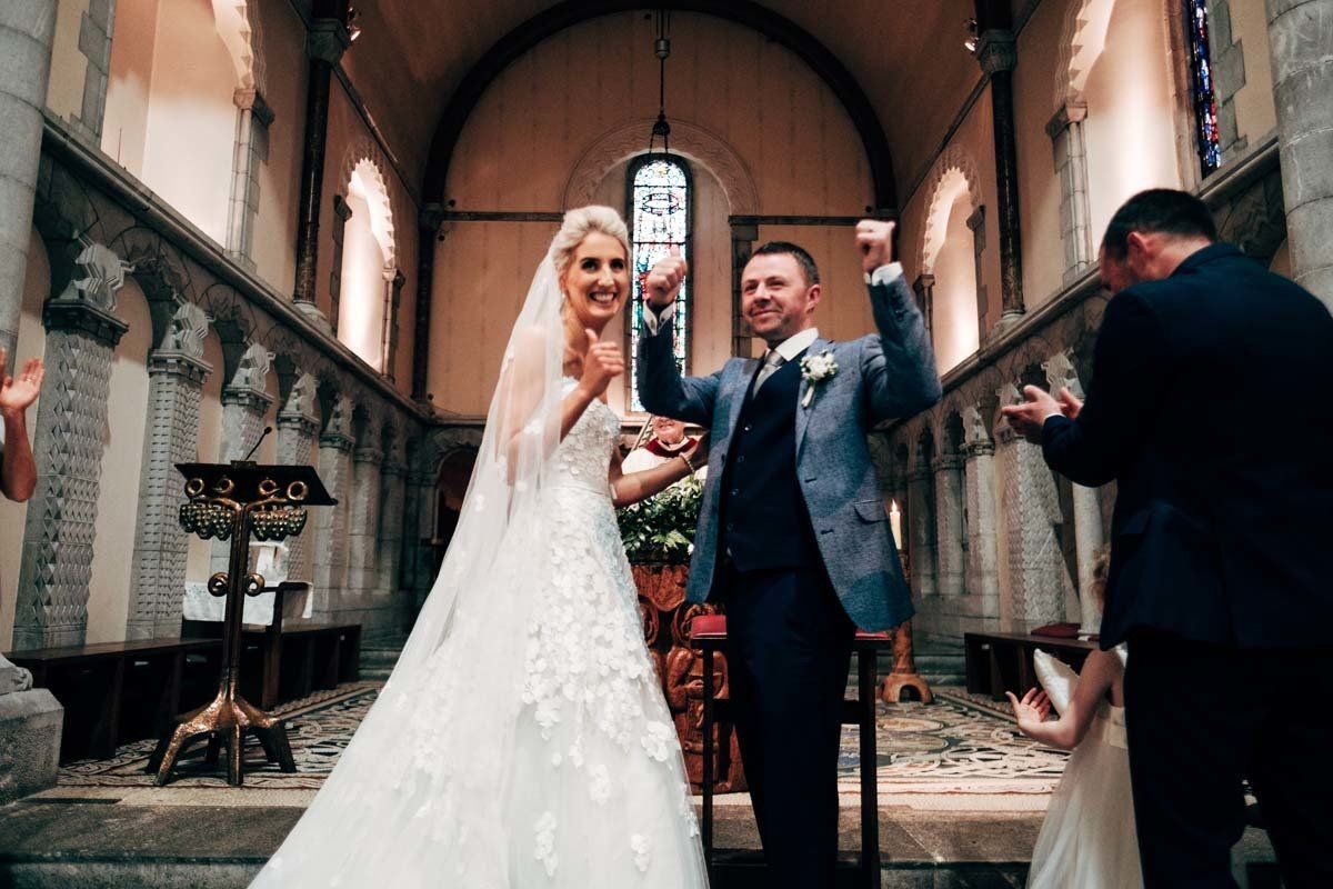 wedding couple celebrating at Honan Chapel UCC Cork