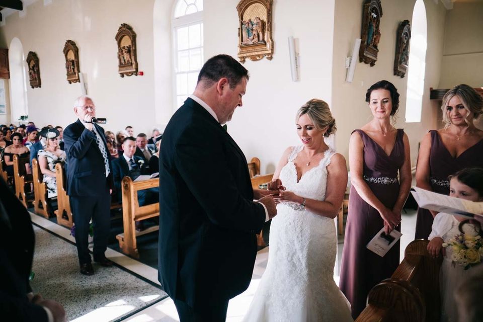 bride and groom getting married exchanging rings