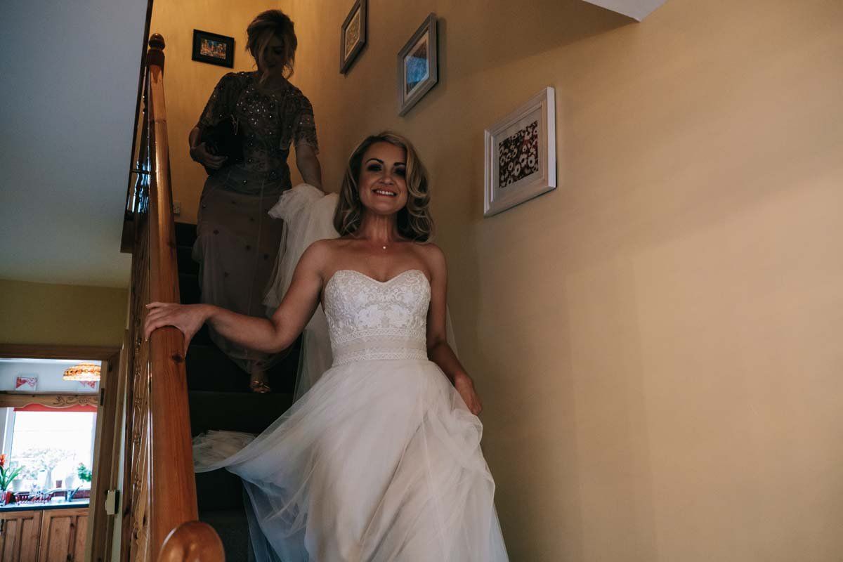 wedding photographer cork - bride coming down stairs