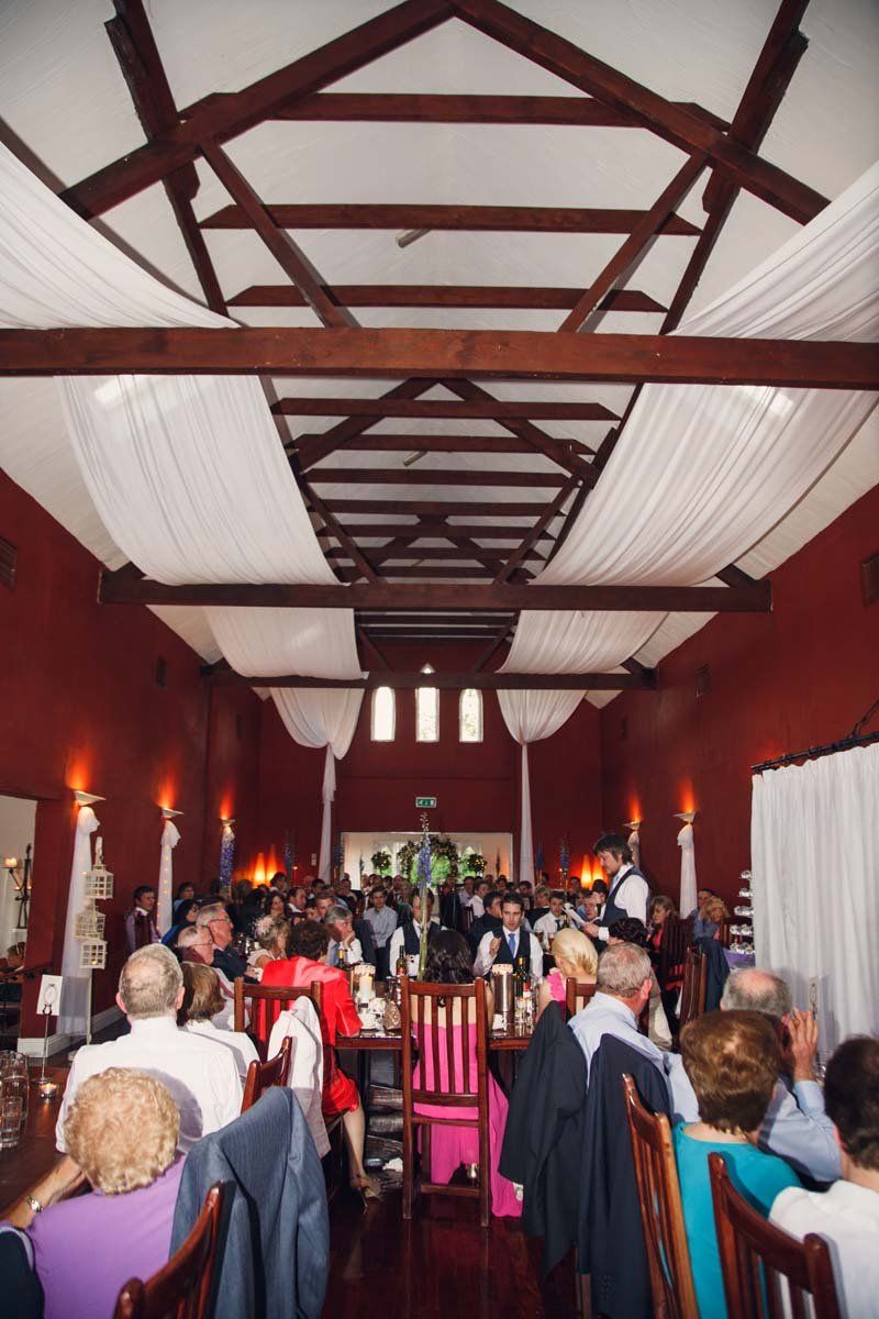 wedding party inside dining hall at Barnabrow House