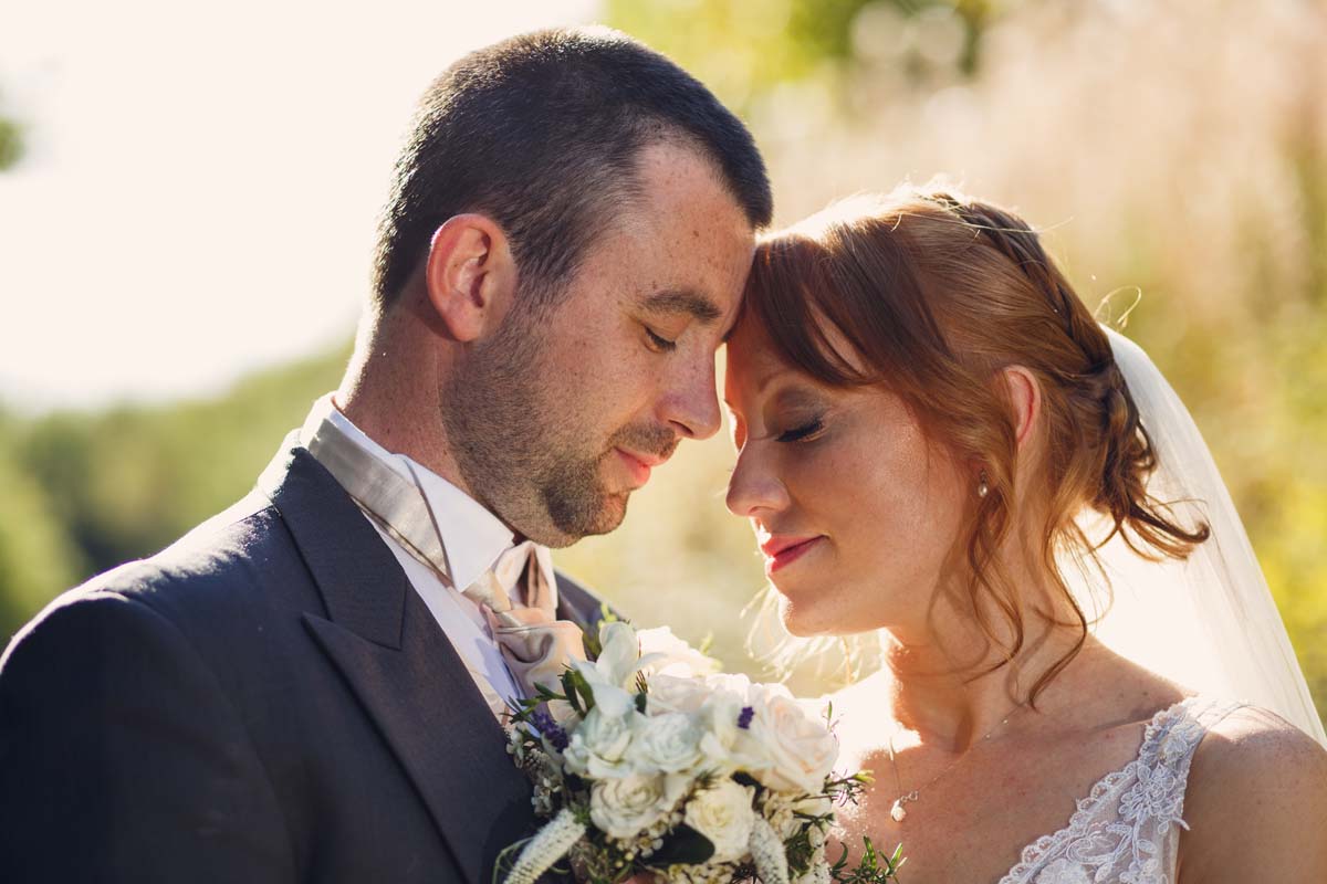 Barnabrow house wedding with couple newly weds embracing in autumn light