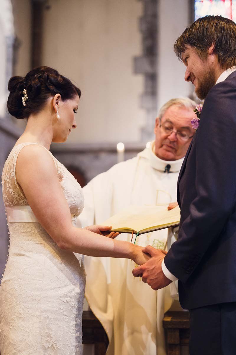 wedding couple at alter getting married at Honan Chapel UCC