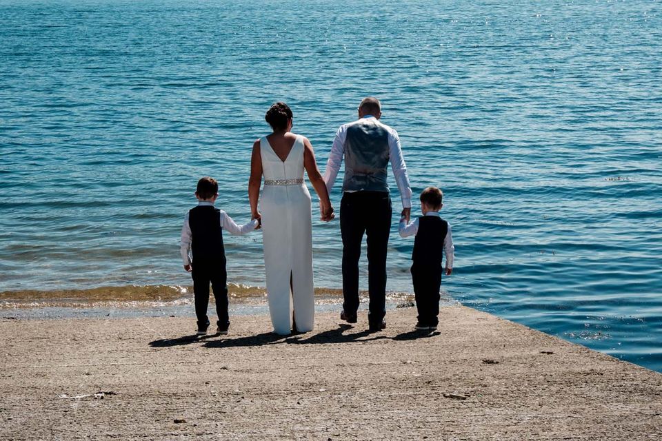 family wedding photo at Kenmare bay looking into the wild atlantic way 