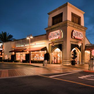 A building with a sign that says ' ruby 's ' on it