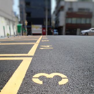 A parking lot with the number 3 painted on it