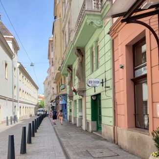 A sign on the side of a building says hotel
