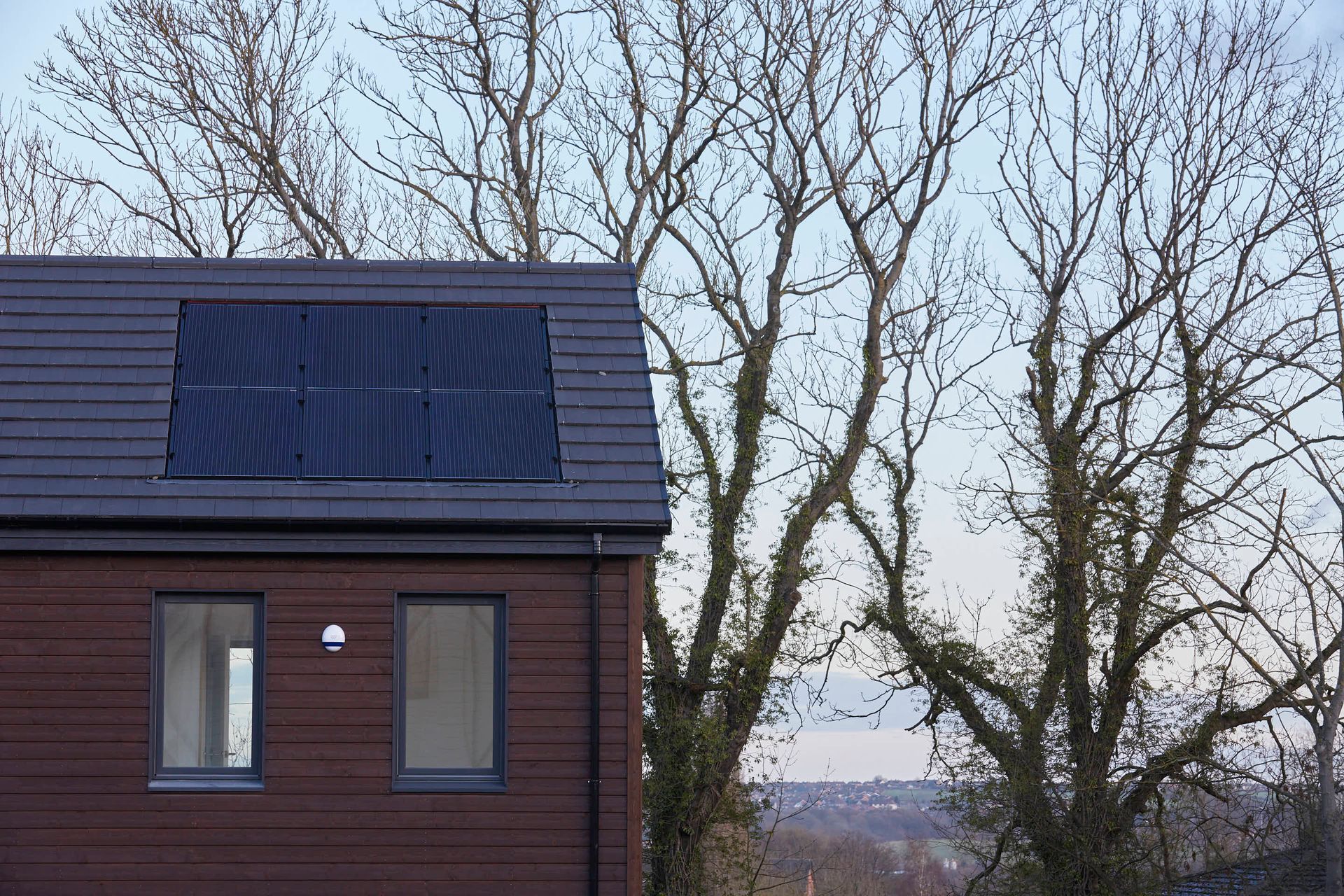 A zero energy housing development built by TALO in Chesterfield using a solar package to power hot water and underfloor heating