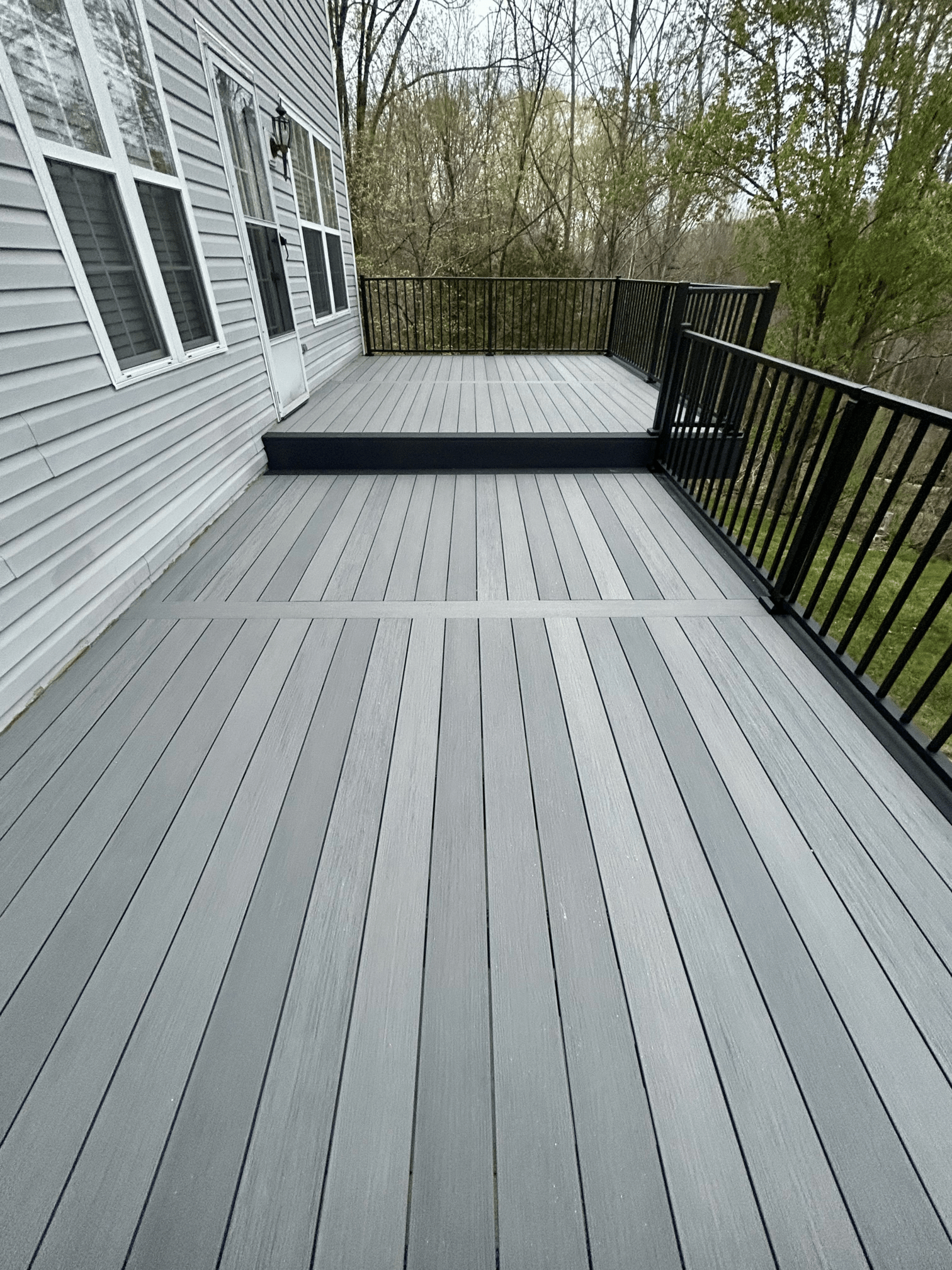 Multi-level wooden decks with custom seating areas.