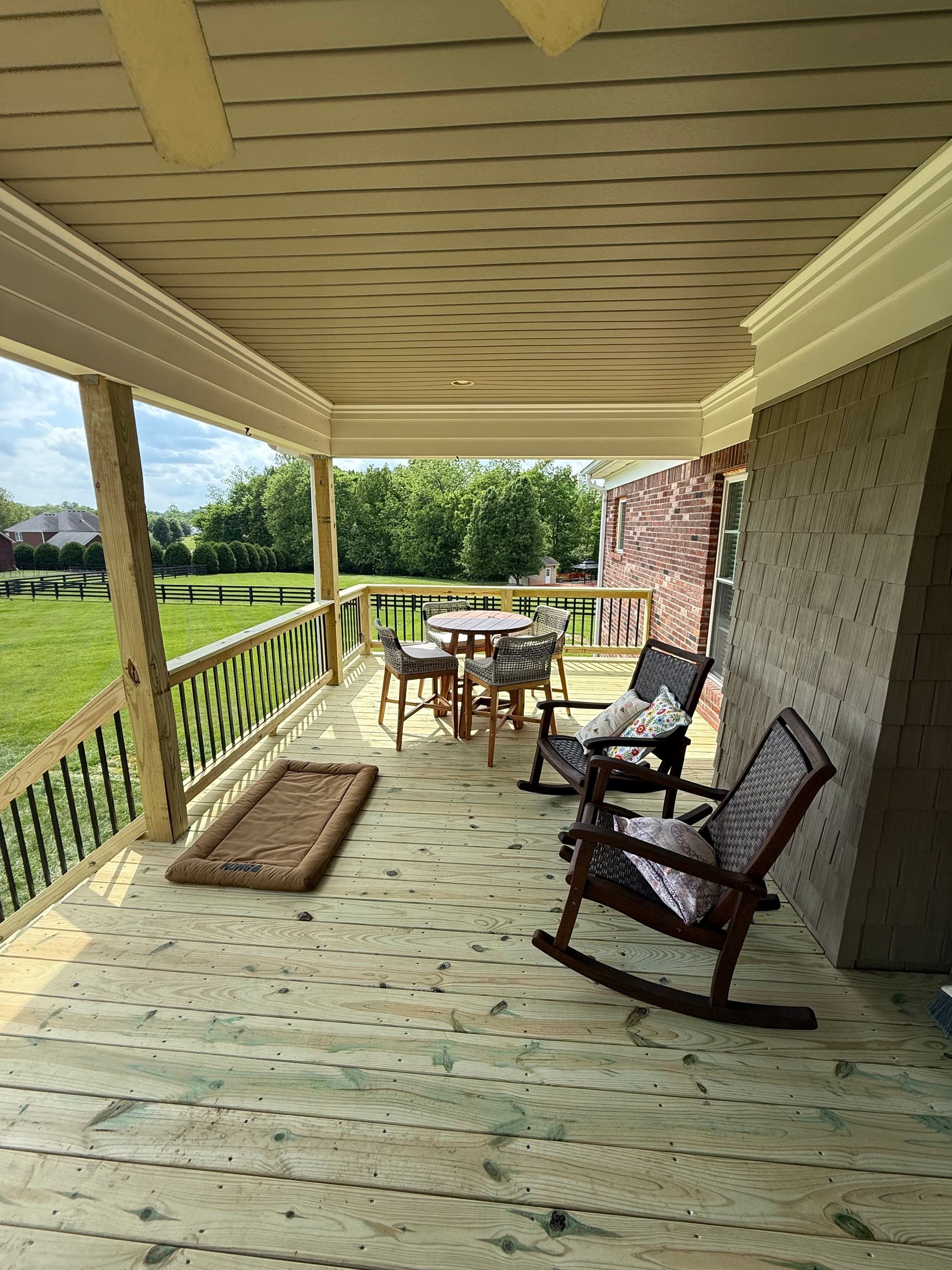 Outdoor deck construction in Pendleton – DeckHeadSky custom wood deck with stairs and open railing built in a natural setting