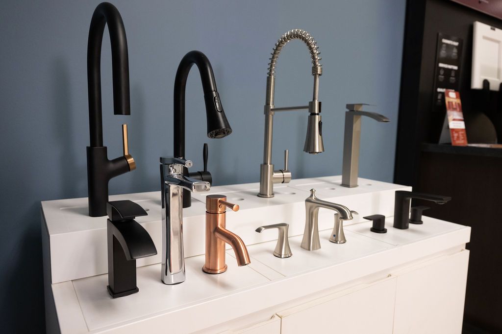 A variety of bathroom faucets are on display in the CSK Showroom