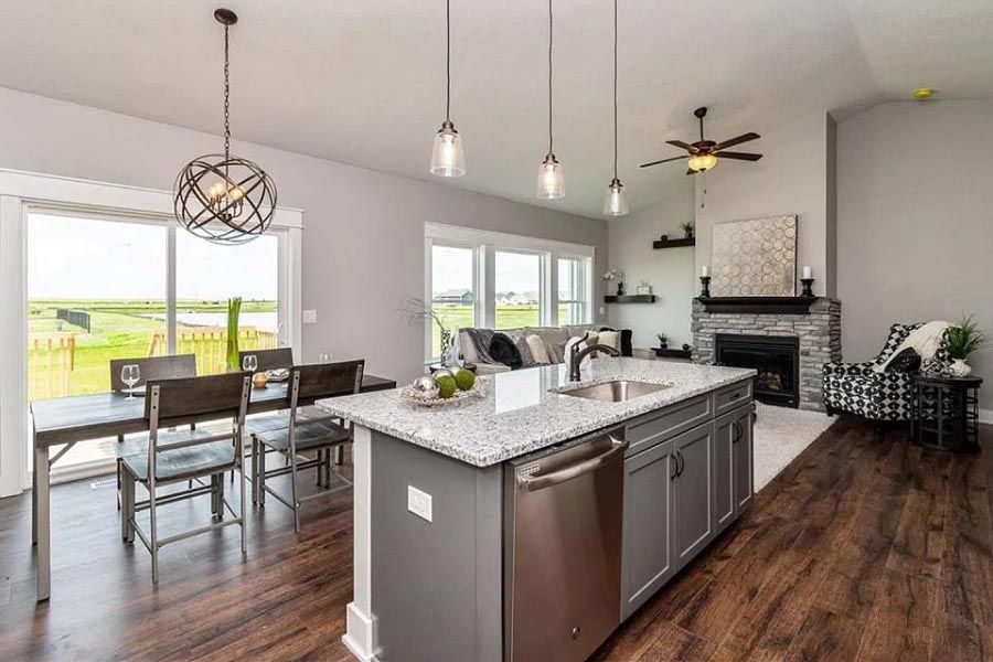 A kitchen with a large island in the middle of the room.