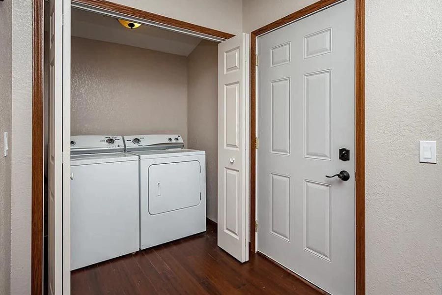 A laundry room with a washer and dryer in it.